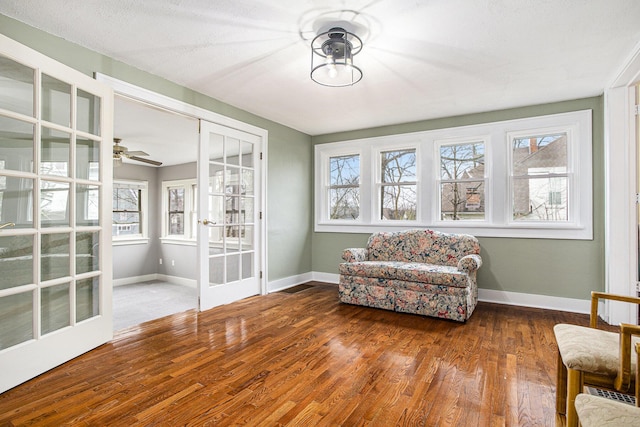 320 N Division St, Marshall, MI 49068 - sitting room with french doors, baseboards, and wood finished floors