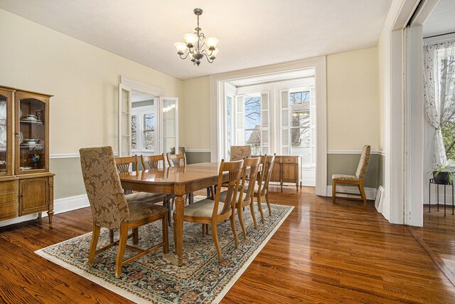 320 N Division St, Marshall, MI 49068 - dining space featuring dark wood-type flooring, baseboards, and a chandelier
