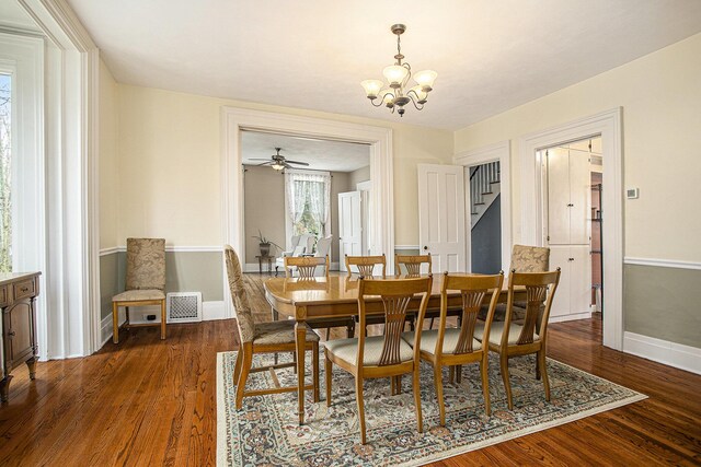 320 N Division St, Marshall, MI 49068 - dining space with a chandelier, dark wood-style flooring, baseboards, and visible vents