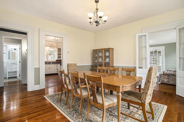 320 N Division St, Marshall, MI 49068 - dining area with a chandelier, dark wood finished floors, and a wealth of natural light