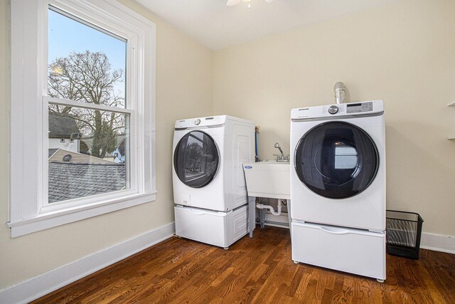320 N Division St, Marshall, MI 49068 - laundry area with laundry area, dark wood-type flooring, a sink, baseboards, and washer and clothes dryer