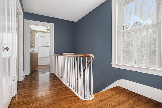320 N Division St, Marshall, MI 49068 - hall featuring an upstairs landing and wood finished floors