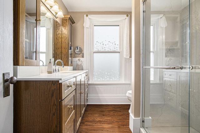320 N Division St, Marshall, MI 49068 - full bathroom with toilet, a stall shower, wood finished floors, and vanity