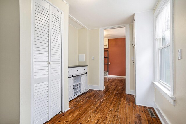 320 N Division St, Marshall, MI 49068 - hall with dark wood-style flooring, baseboards, and visible vents