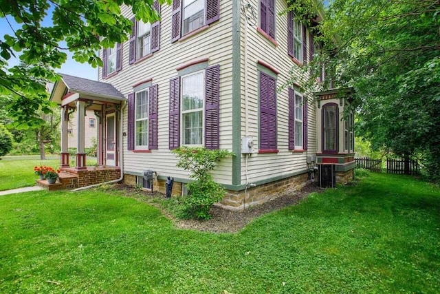 320 N Division St, Marshall, MI 49068 - view of home's exterior with a yard and fence