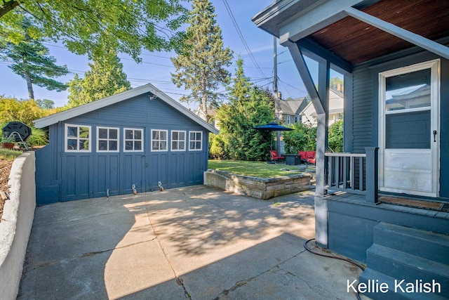 548 Pleasant St SE, Grand Rapids, MI 49503 - view of patio / terrace featuring an outbuilding