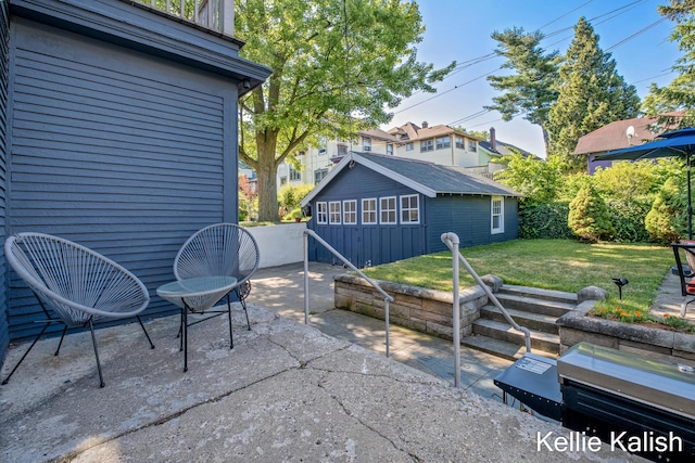 548 Pleasant St SE, Grand Rapids, MI 49503 - view of patio / terrace with an outbuilding