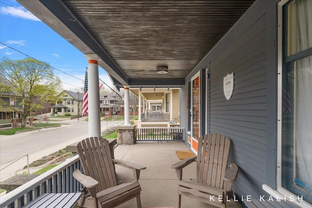 548 Pleasant St SE, Grand Rapids, MI 49503 - covered porch featuring a residential view