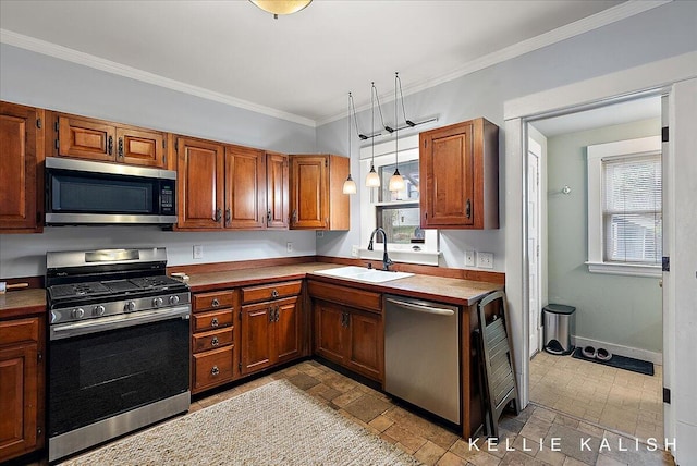 548 Pleasant St SE, Grand Rapids, MI 49503 - kitchen featuring appliances with stainless steel finishes, healthy amount of natural light, ornamental molding, and brown cabinetry