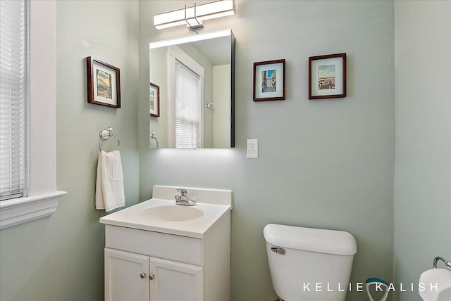 548 Pleasant St SE, Grand Rapids, MI 49503 - half bath featuring toilet and vanity