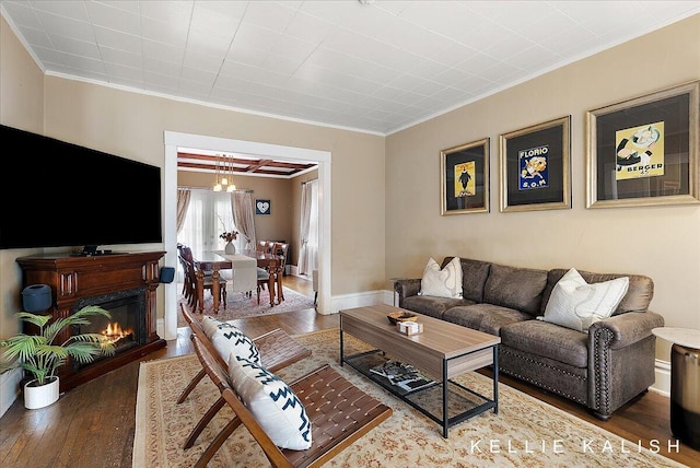 548 Pleasant St SE, Grand Rapids, MI 49503 - living area featuring crown molding, wood-type flooring, and a chandelier
