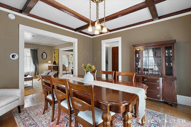 548 Pleasant St SE, Grand Rapids, MI 49503 - dining area with coffered ceiling, hardwood / wood-style floors, beamed ceiling, and crown molding
