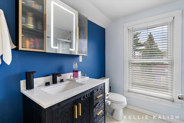 548 Pleasant St SE, Grand Rapids, MI 49503 - bathroom featuring vanity and vaulted ceiling