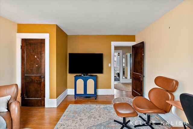 548 Pleasant St SE, Grand Rapids, MI 49503 - living room with wood finished floors and baseboards