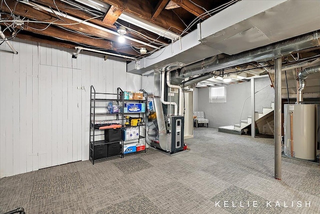 548 Pleasant St SE, Grand Rapids, MI 49503 - below grade area with gas water heater, wooden walls, carpet flooring, and stairs