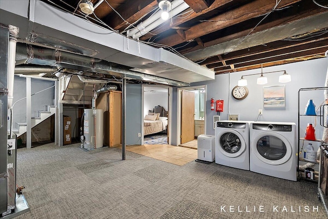 548 Pleasant St SE, Grand Rapids, MI 49503 - unfinished below grade area featuring gas water heater, independent washer and dryer, stairs, and carpet flooring