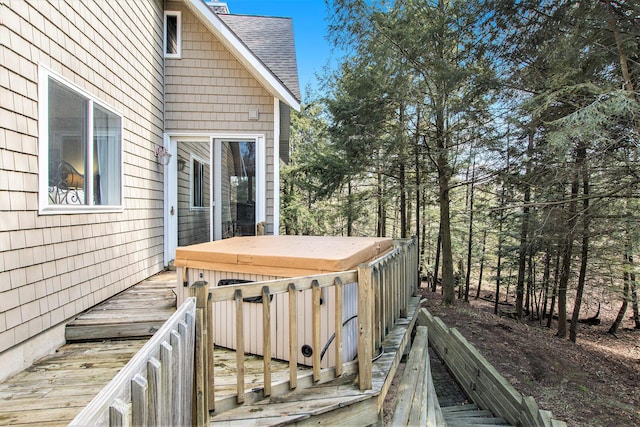 deck with a covered hot tub