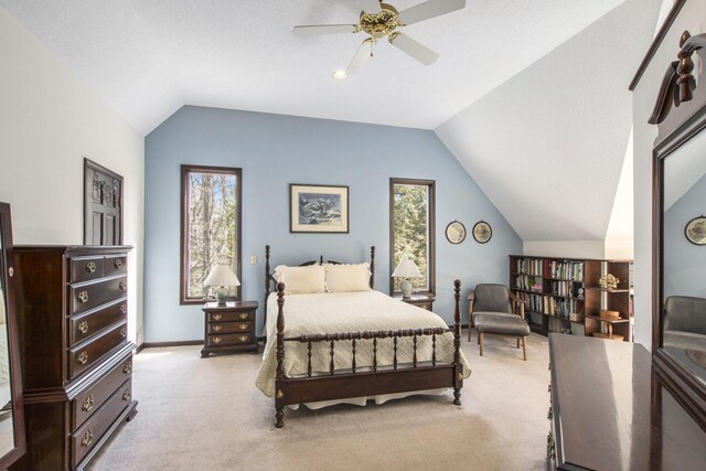 bedroom featuring baseboards, carpet flooring, ceiling fan, and vaulted ceiling