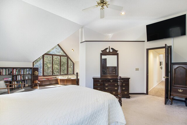 bedroom featuring baseboards, lofted ceiling, light colored carpet, and ceiling fan