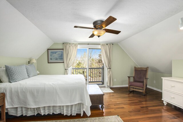 bedroom featuring access to exterior, vaulted ceiling, a ceiling fan, wood finished floors, and baseboards