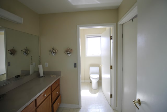 424 Little Lake Dr Unit 40, Ann Arbor, MI 48103 - bathroom with vanity, baseboards, and toilet