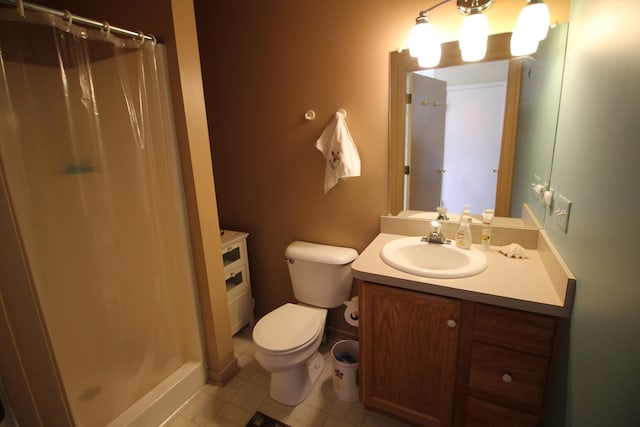 424 Little Lake Dr Unit 40, Ann Arbor, MI 48103 - full bathroom featuring vanity, toilet, and a shower with shower curtain