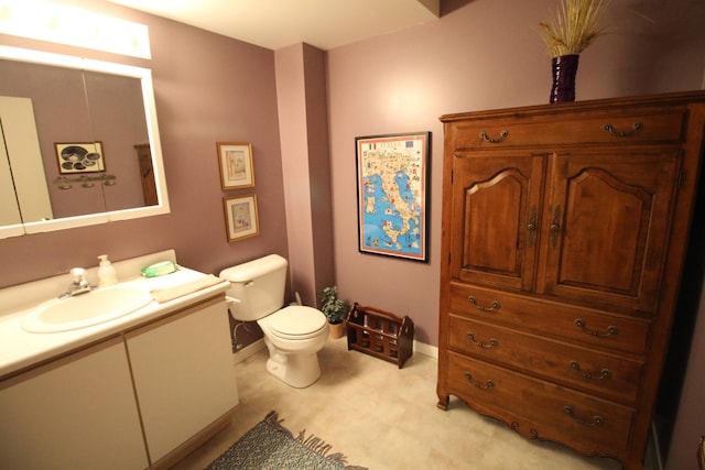 424 Little Lake Dr Unit 40, Ann Arbor, MI 48103 - bathroom with toilet, baseboards, and vanity