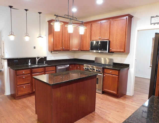 2535 Holiday House Rd Unit 24, Saint Joseph, MI 49085 - kitchen with stainless steel appliances, a sink, light wood-type flooring, and brown cabinets