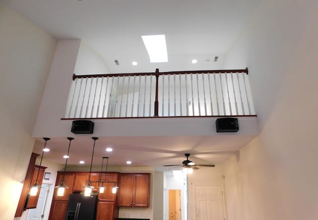 2535 Holiday House Rd Unit 24, Saint Joseph, MI 49085 - detailed view of black refrigerator with ice dispenser, ceiling fan, a skylight, and recessed lighting
