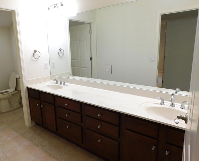 2535 Holiday House Rd Unit 24, Saint Joseph, MI 49085 - full bathroom with tile patterned flooring, double vanity, and toilet