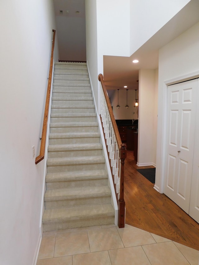 2535 Holiday House Rd Unit 24, Saint Joseph, MI 49085 - stairway with tile patterned flooring, baseboards, and recessed lighting