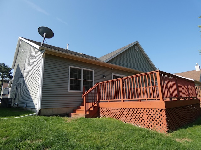 2535 Holiday House Rd Unit 24, Saint Joseph, MI 49085 - rear view of property with a yard and a wooden deck