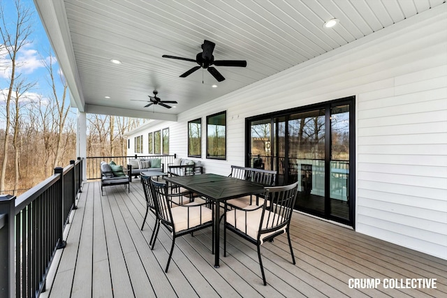 wooden deck featuring an outdoor hangout area, ceiling fan, and outdoor dining area