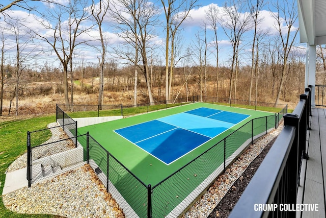 view of tennis court with fence