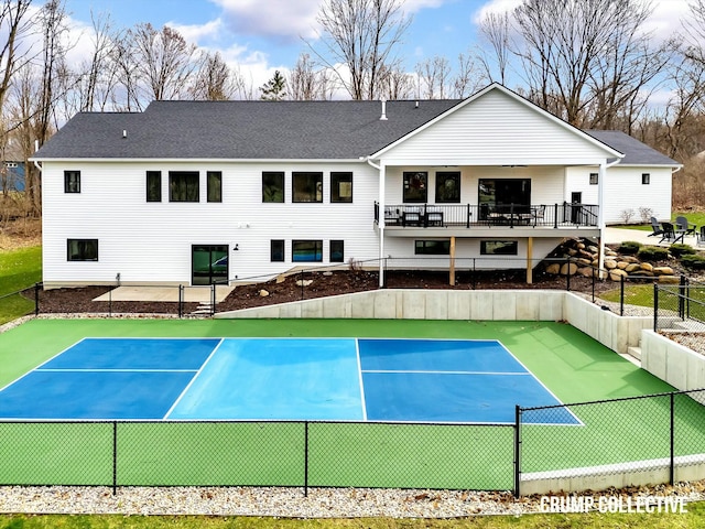 view of tennis court with fence