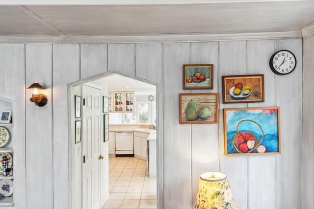 4117 Lake Shore Dr, New Buffalo, MI 49117 - hallway featuring wood walls, a sink, and light tile patterned floors