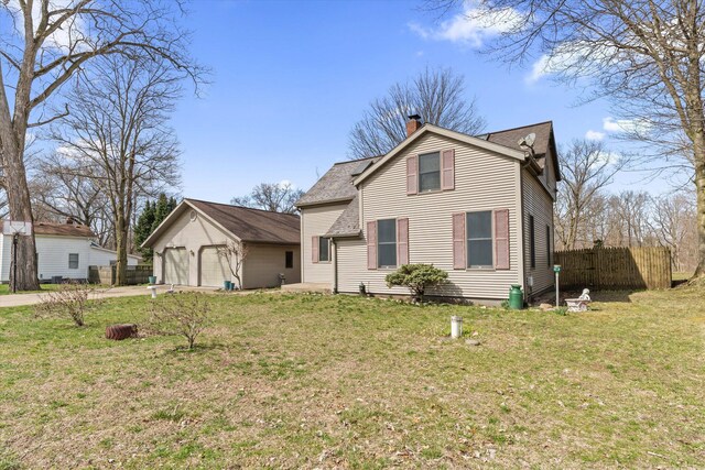 33028 Pokagon Hwy, Niles, MI 49120 - traditional-style home featuring a chimney, a front yard, a detached garage, and fence