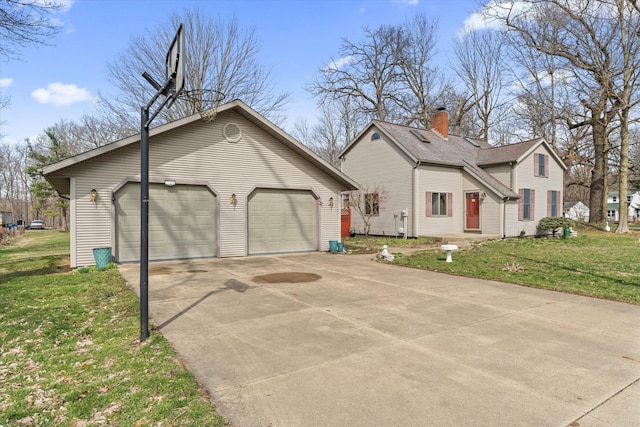 33028 Pokagon Hwy, Niles, MI 49120 - view of home's exterior featuring driveway, an outbuilding, a garage, and a yard