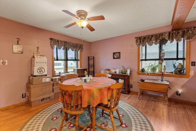 33028 Pokagon Hwy, Niles, MI 49120 - dining room with baseboards, ceiling fan, and light wood-type flooring