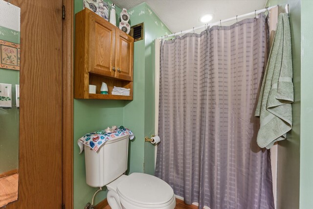 33028 Pokagon Hwy, Niles, MI 49120 - bathroom featuring toilet and a shower with curtain