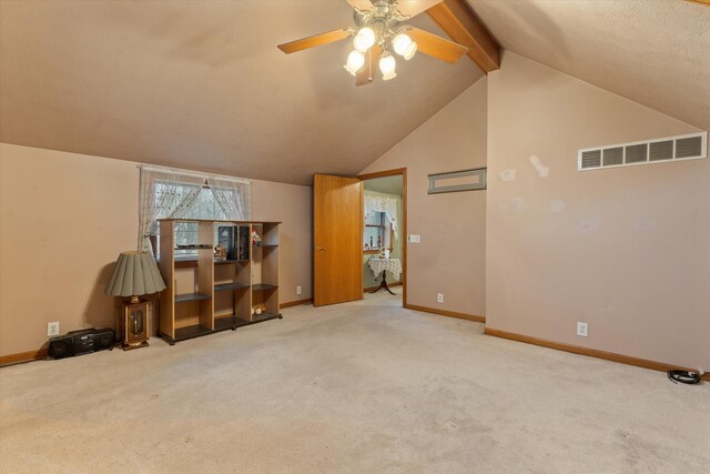 33028 Pokagon Hwy, Niles, MI 49120 - living area featuring carpet flooring, ceiling fan, visible vents, and vaulted ceiling with beams
