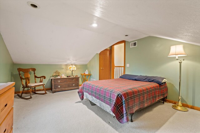 33028 Pokagon Hwy, Niles, MI 49120 - bedroom with carpet, baseboards, vaulted ceiling, and visible vents