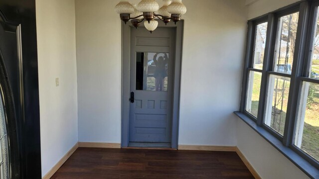 entrance to property with a ceiling fan