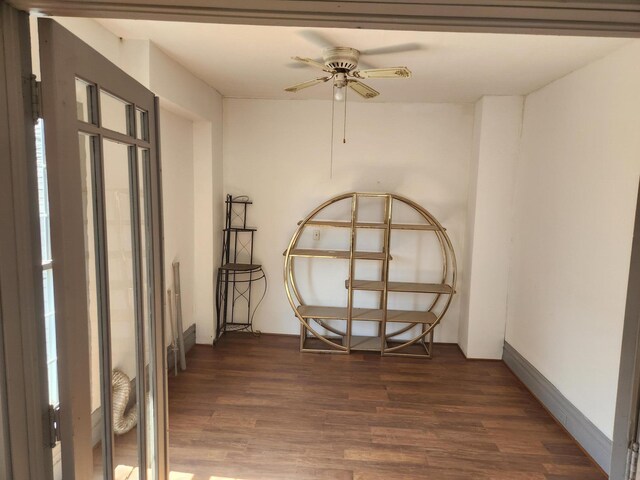 unfurnished room with a ceiling fan and wood finished floors