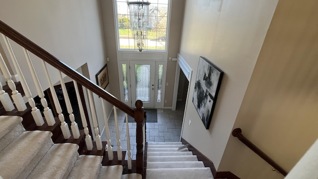19528 Norway Pine Dr, Macomb, MI 48044 - foyer with stone tile floors, stairway, and a towering ceiling