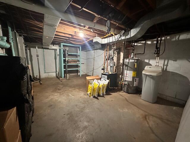 unfinished below grade area with electric water heater