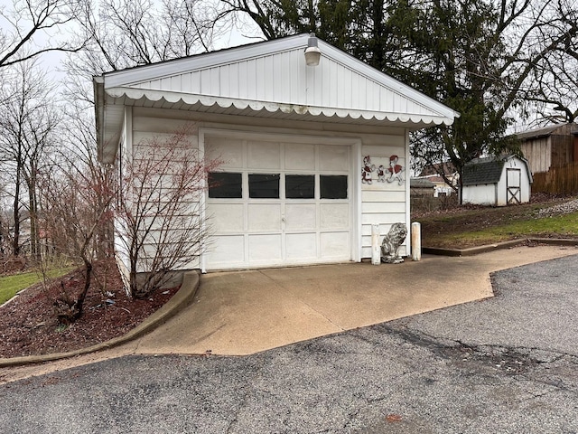detached garage with aphalt driveway