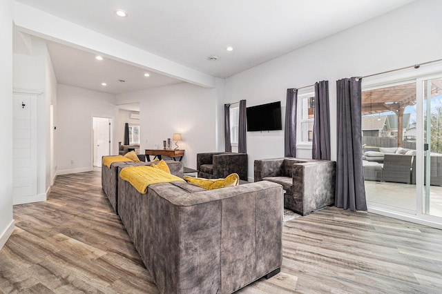 1641 N Arrowhead Rd, Mears, MI 49436 - living area featuring beamed ceiling, baseboards, recessed lighting, and wood finished floors