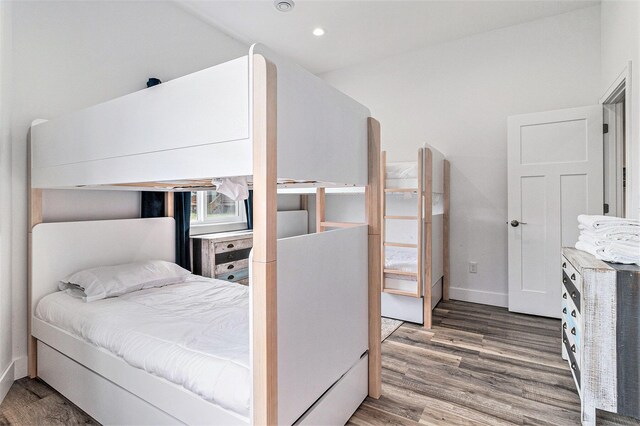 1641 N Arrowhead Rd, Mears, MI 49436 - bedroom featuring wood finished floors, baseboards, and recessed lighting