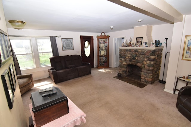 living area featuring carpet and a fireplace